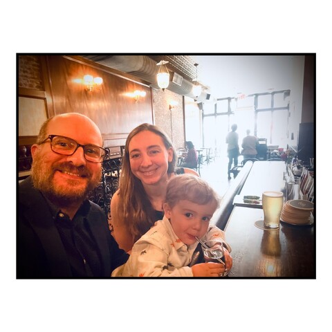 Selfie of me, my wife and son at a bar in Brooklyn