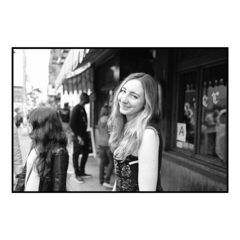 Photo of Amanda outside a bar in 2016