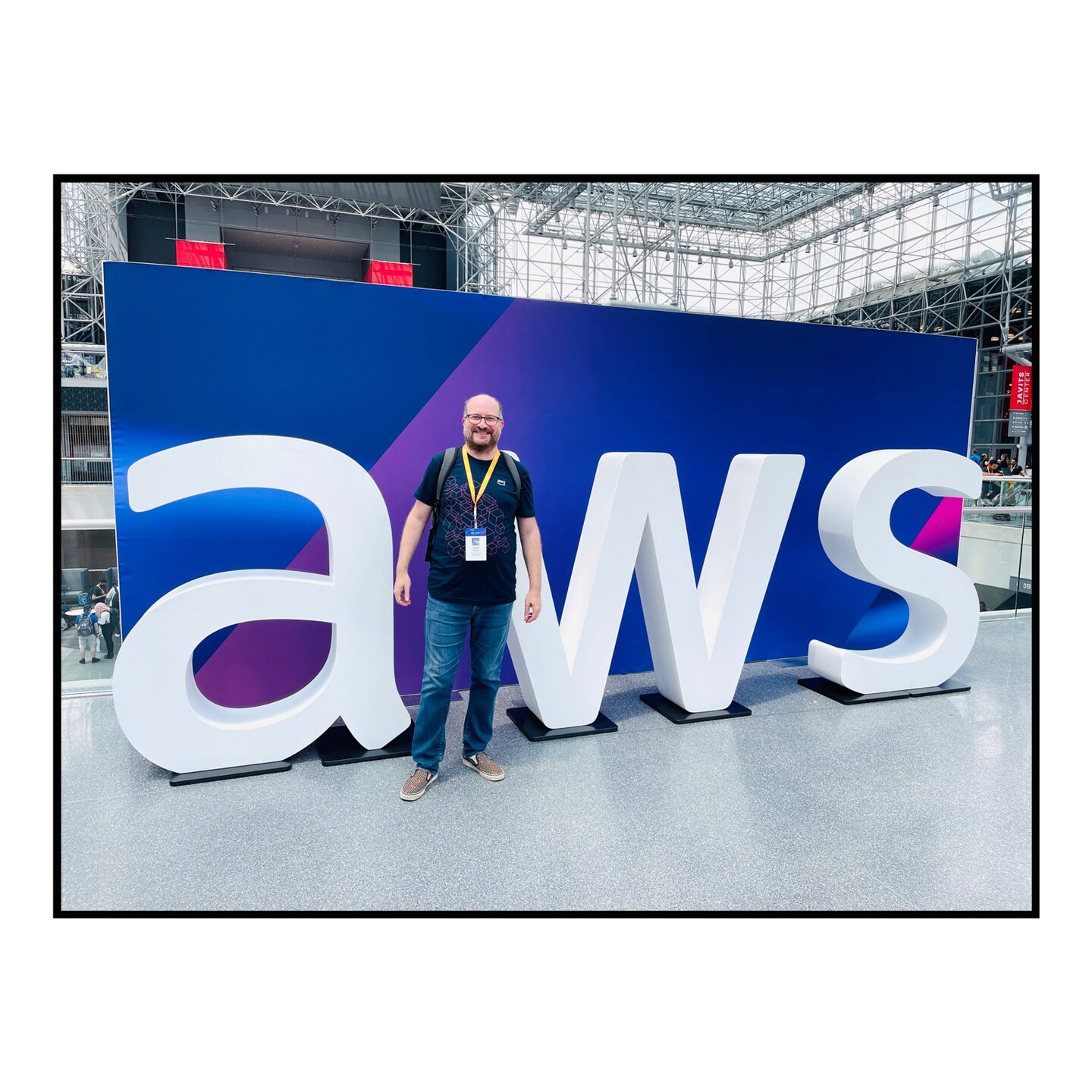 Me, standing in front of an AWS display at the Jacob Javits Center