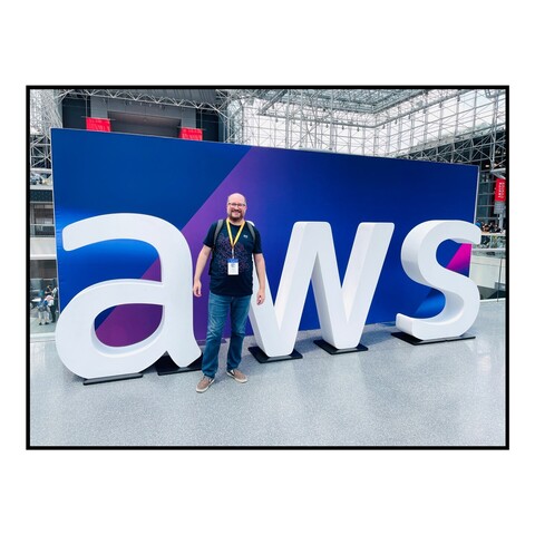 Me, standing in front of an AWS display at the Jacob Javits Center