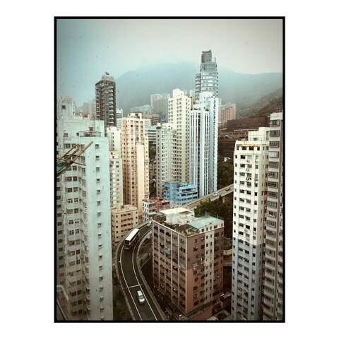 View from a hotel overlooking buildings in Hong Kong