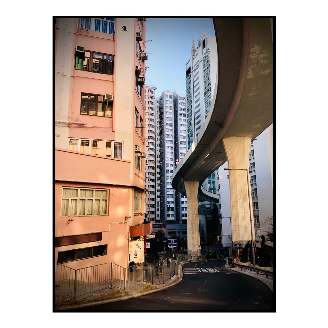 Pink buildings and elevated roads in Hong Kong.