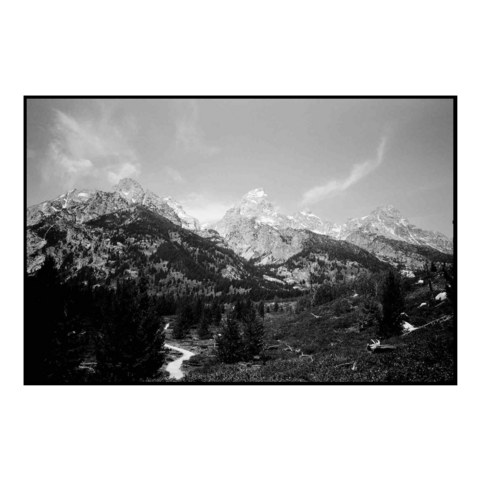 A black and white photo depicting the Grand Tetons mountains 