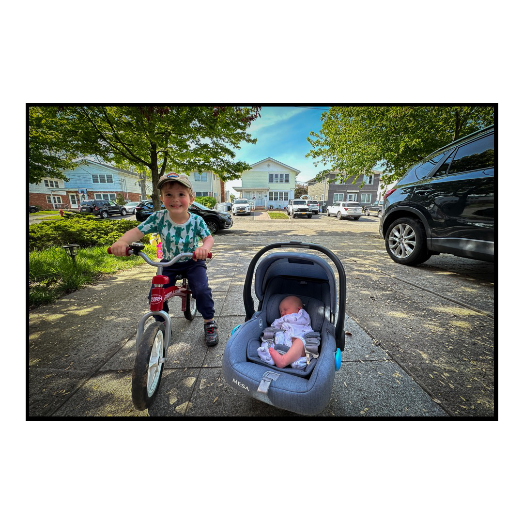 Sim and daughter posing on the driveway.